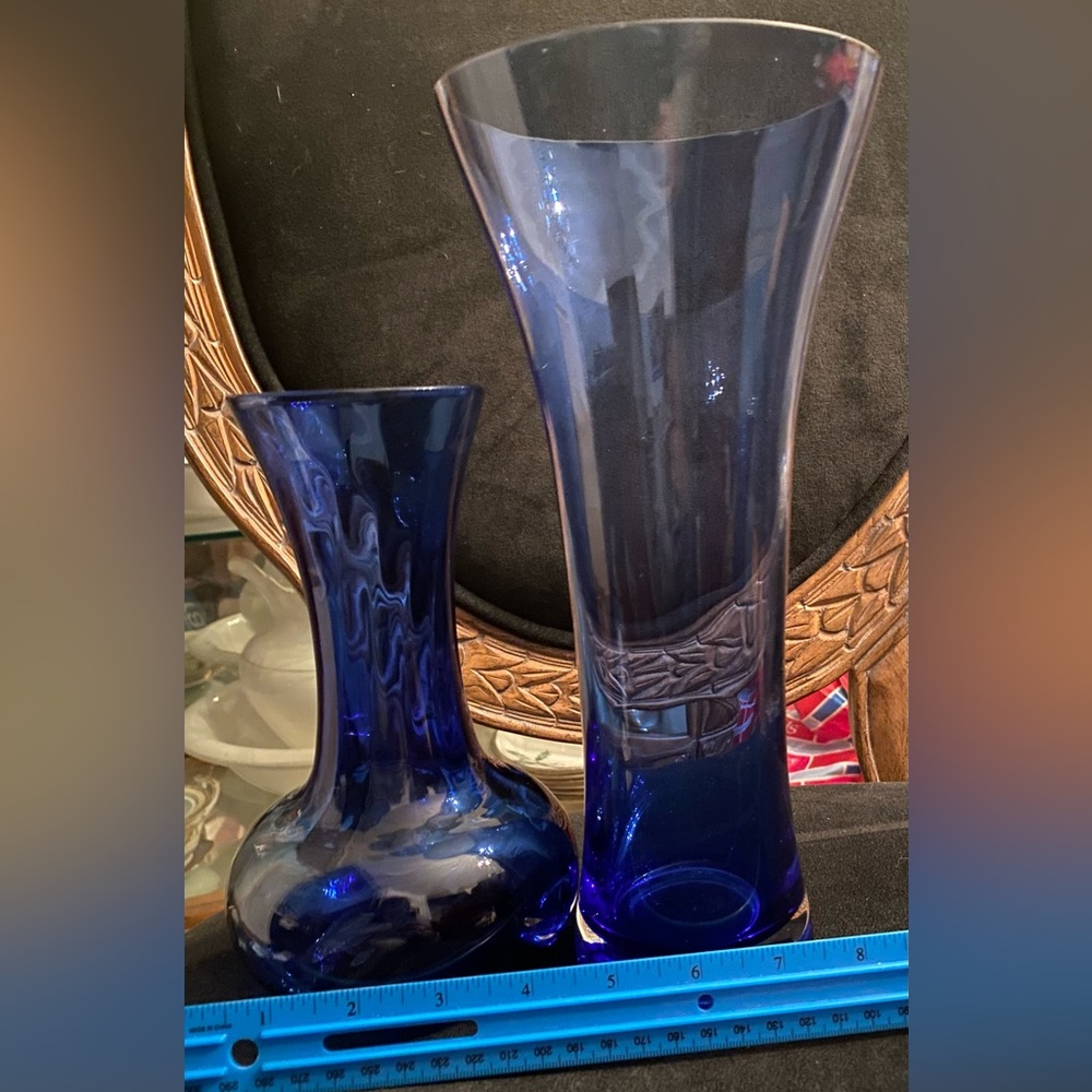 Two Blue glass flower vases.